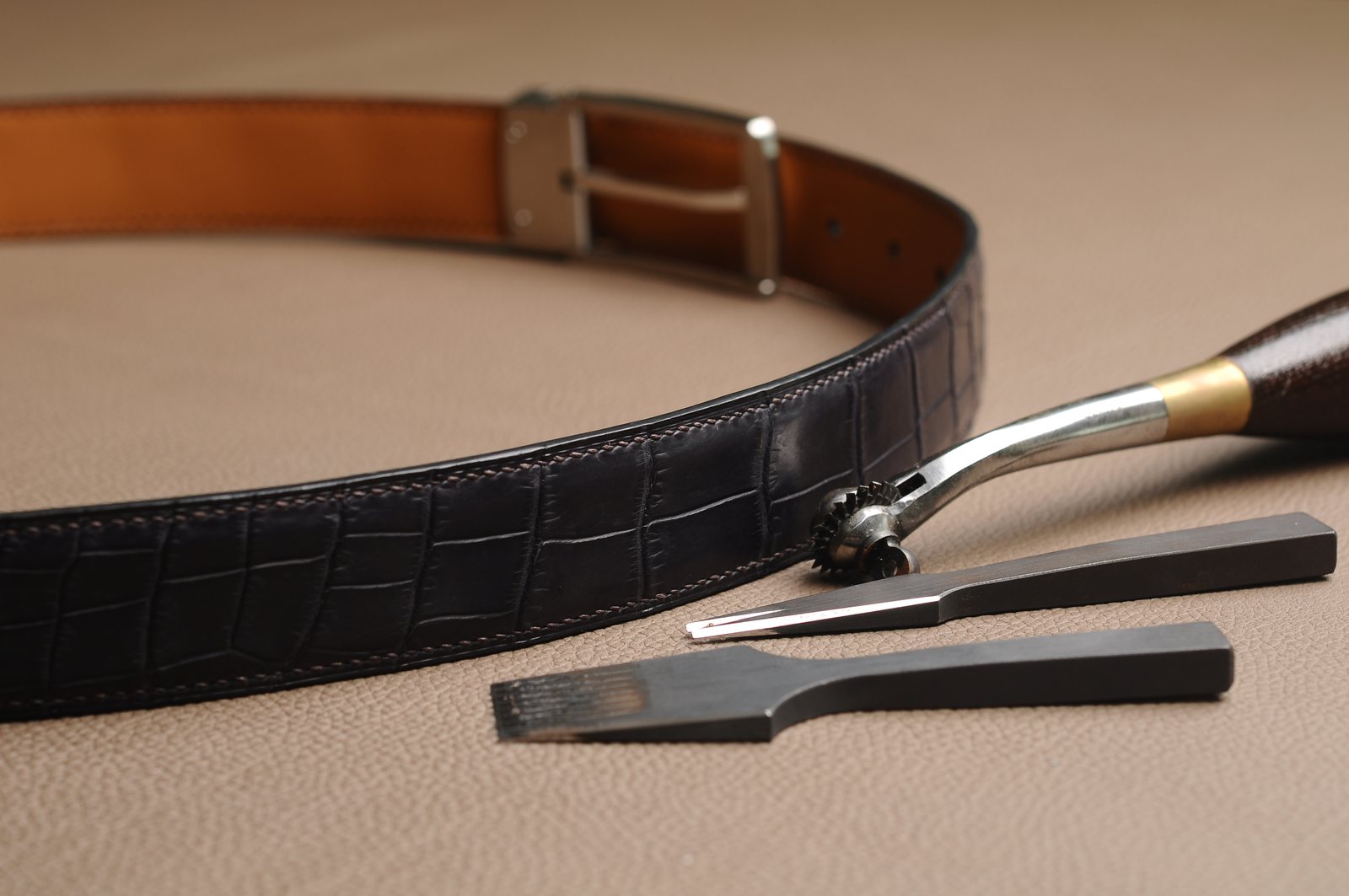 Leather belt with tools and hardware in the workshop