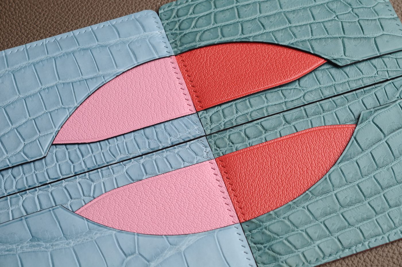 Close-up of compact leather card holder edge and stitching