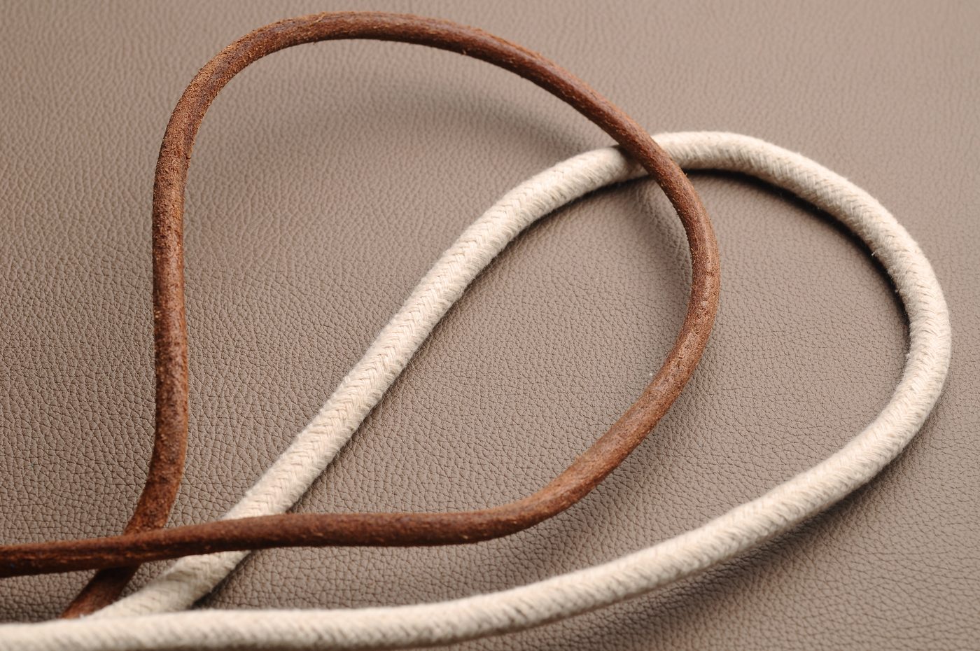 Close-up of leather edge finishing and handwork detail