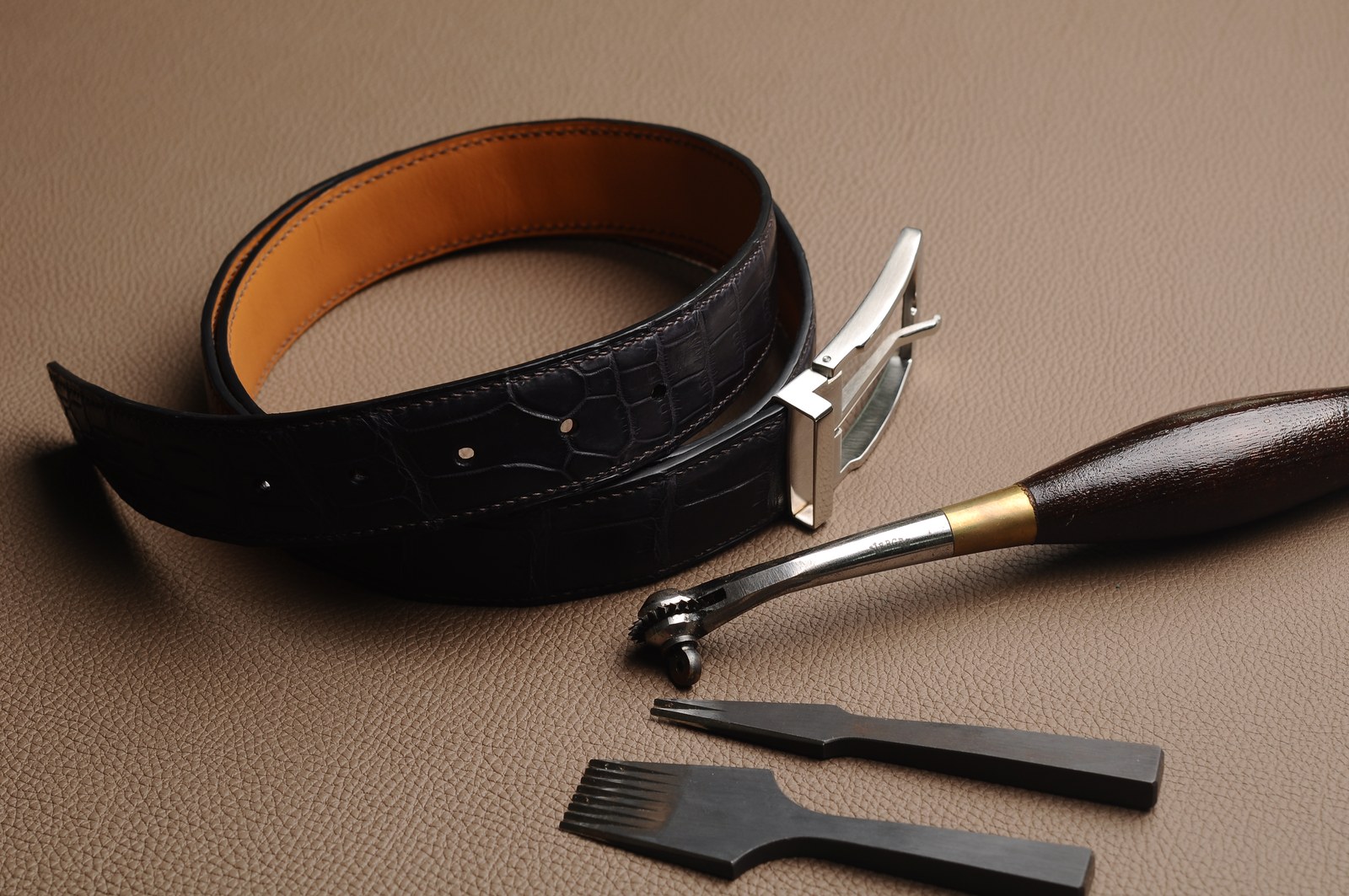 Leather belt, buckle and leatherworking tools