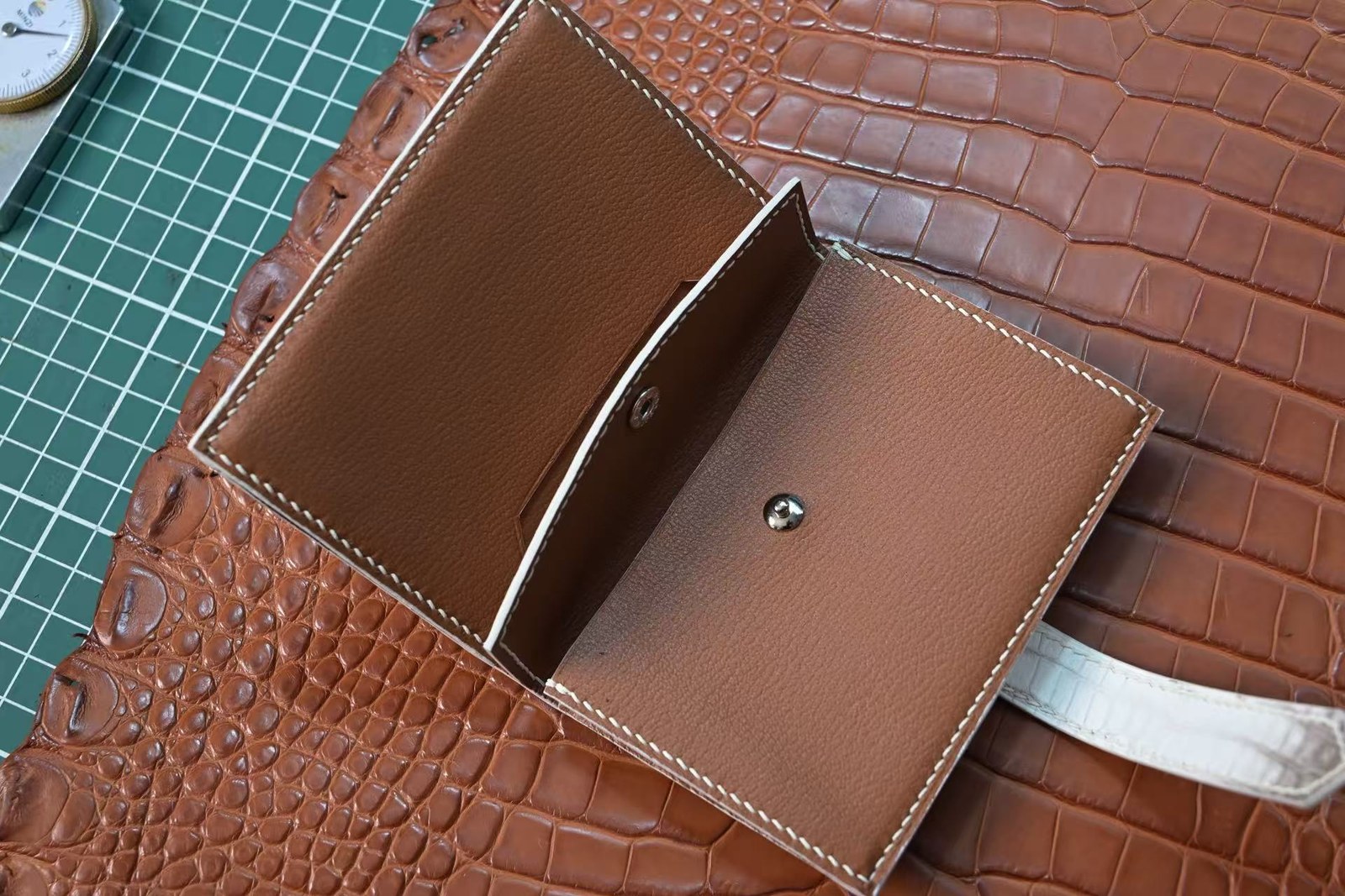Two-tone crocodile leather coin purse with snap closure